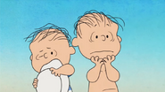 Linus and Rerun shocked to see Lucy sends Charlie Brown into the sand hole after his beach ball destroyed her beach boat