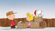 Charlie and Sally Brown are giving toys to Toy Drive by Snoopy