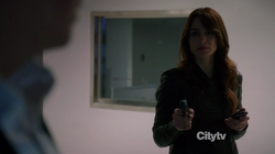 Holding her victims at gunpoint