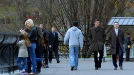 The bodyguard following Reese and Finch in Central Park. (“Pilot”)