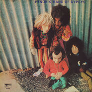 Puppets of Peel (sitting on left), Bob Dylan (sitting on right), Brian Jones (standing on left) and Jimi Hendrix (standing on right) from the original cover of Hendrix's LP Band Of Gypsys (Track, 1970).