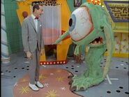 Pee-wee and Roger, with the season 1 design of the Picture Phone in the background. Notice the original red seat.