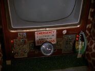 The "controls" of the picturephone with emergency number sticker as seen in "Fire In The Playhouse"