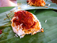 Nasi lemak, usually eaten for breakfast, is one of the most popular Malay street food in Malaysia and Singapore.