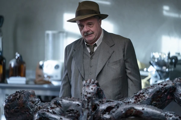 Lewis looks at the charred remains on his friends