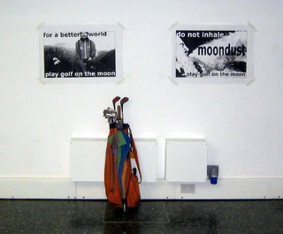 "For a better world, play golf on the moon" - art by Paul Conneally at Mile End Art Pavilion. Photo by Greenbelt. Licensed under Creative Commons, courtesy Wikimedia Commons.