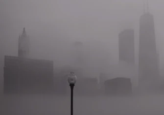 Chicago, Illinois skyline in fog, August 2002. Photo by David Sky. Licensed under Creative Commons, courtesy Wikimedia Commons.