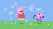 Peppa playing with bubbles.