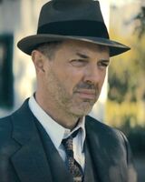 Eric Lange as Detective Holcomb