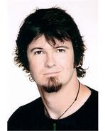 Greg Ellis without his glasses.