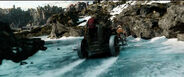 Balin, Kili, and Dwalin riding on a war-chariot.