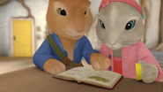 Peter and Lily looking at the journal