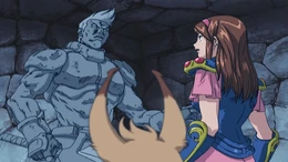 Odin, petrified, is discovered by Alis and Myau in Phantasy Star: Generation 1.