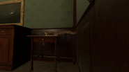 A spine on a small table in the dining room.