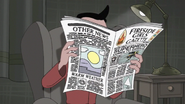 Khaka Peu Peu reads the newspaper.