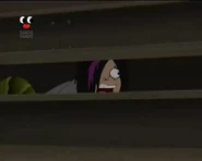 Johnny hiding behind the gym bleachers