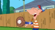 Phineas catches the baseball in their backyard.