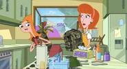 Candace gives Linda a camouflage backpack