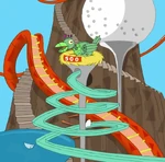 A bird catches and drops the golf ball down a slide.