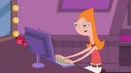 Candace typing at her computer, trying to get concert tickets to see the Paisley Sideburn Brothers.