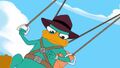 Agent P looking at his wristwatch communicator