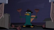 NOTLP-433-Perry holding two plungers.jpg (197 KB)