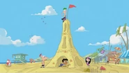 Ferb on top of a sand tower.