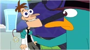 Agent P holding a Doofenshmirtz toy.