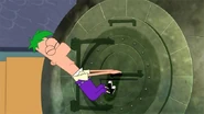 Ferb tries to open the capsule but to no avail.