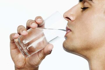 Man drinking Water Glass