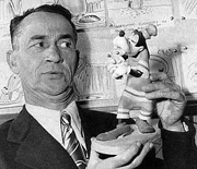 Pinto Colvig avec une statuette de .