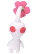 A plushie of a white pikmin.