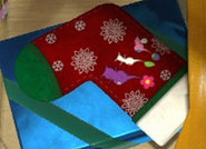 A stocking featuring a Winged, a White, and a Purple Pikmin.