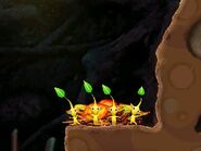 Yellow Pikmin striking a pose in a cave in Hey! Pikmin