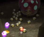 Olimar being followed by a group of Bulborb Larvae.
