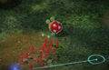 A Dwarf Red Bulborb in Pikmin 3 being targeted.