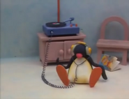 Pingu listening to music.