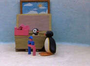 Pinga helping Pingu to build a tower in Pingu and Pinga Stay Up.