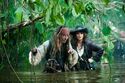 Captain Jack (Johnny Depp) and Angelica (Penélope Cruz) make their watery way through the jungle in search of the Fountain of Youth.