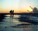 Following a drenching rainstorm that deluged the entire island of Kauai and shut down production for much of the day, the next dawn saw clear skies that allowed the company to shoot an all-important scene on Ke'e Beach with Johnny Depp and Kevin R. McNally. For a shot in which the two walk off into the sunset, cotton-ball clouds suddenly moved in to create a perfect image of the sun's radiant light. Even with all the technological advances that have been made over the past few decades, nothing could match the perfection of that magnificent Hawaiian landscape. All of which is captured in this Peter Mountain photograph.