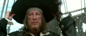 Barbossa putting on his pirate hat