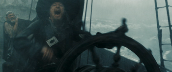 Barbossa at the wheel.