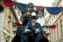 Jack riding on top of a carriage in London.