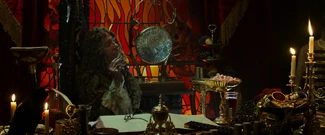 Barbossa enjoying himself in his cabin.