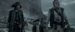 Gibbs with Barbossa and his officers on Whitecap Bay.