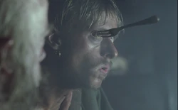 Ragetti wearing the bit of wood as a wooden replacement to his right eye.