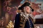 Now a privateer in service to the British crown, Hector Barbossa (Geoffrey Rush) is now incongruously array in a fine naval uniform and adorned in a powdered wig as befits his new rank.