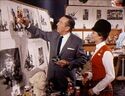 Walt Disney explaining the ride to Julie Riehm.