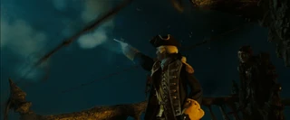 James fires at the rope that connects the two ships.