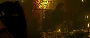 Blackbeard at work on the dark arts in his cabin.